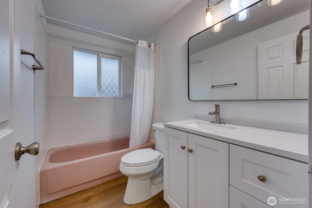 full bathroom with wood finished floors, vanity, toilet, and shower / tub combo with curtain