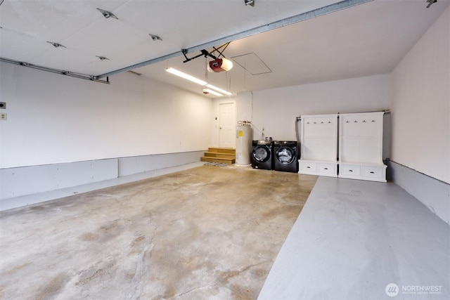 garage featuring a garage door opener, water heater, and independent washer and dryer