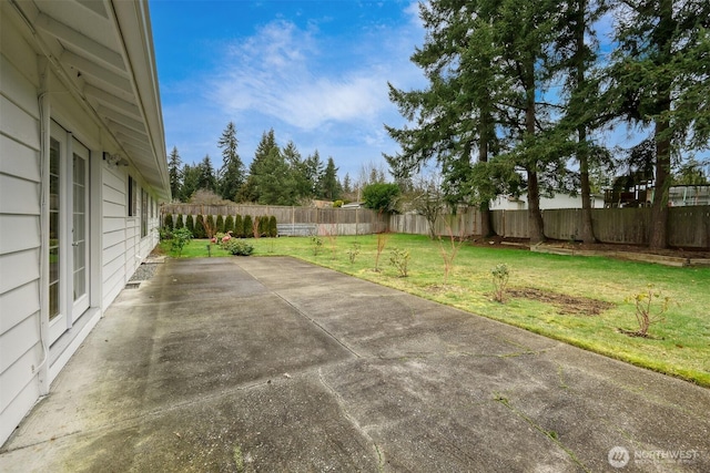 view of yard with a patio area and a fenced backyard