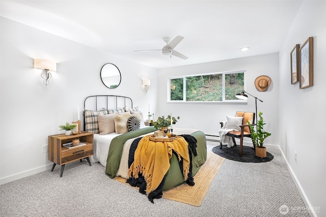 carpeted bedroom with baseboard heating, ceiling fan, baseboards, and recessed lighting