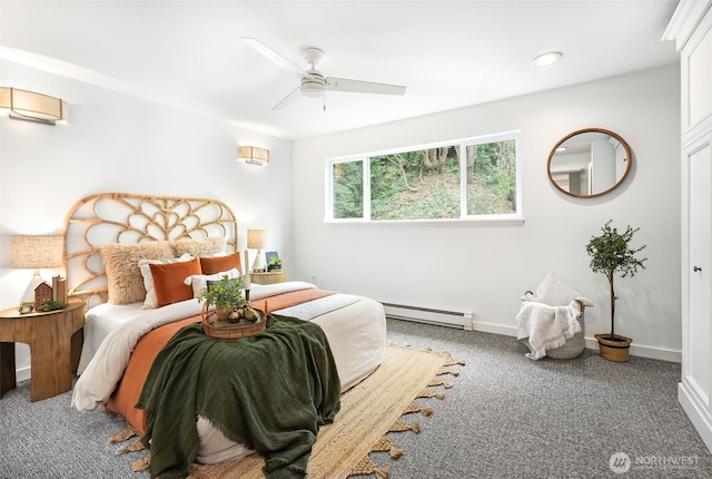 bedroom with carpet floors, baseboards, ceiling fan, and baseboard heating