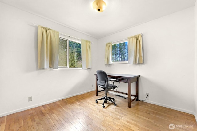 office area featuring hardwood / wood-style floors and baseboards