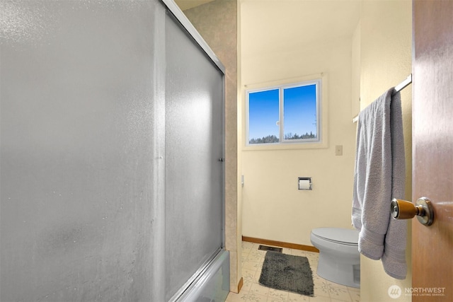 bathroom with visible vents, toilet, baseboards, and combined bath / shower with glass door