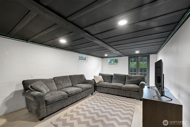 living room featuring concrete block wall and wood finished floors