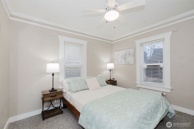 bedroom with a ceiling fan, carpet flooring, crown molding, and baseboards