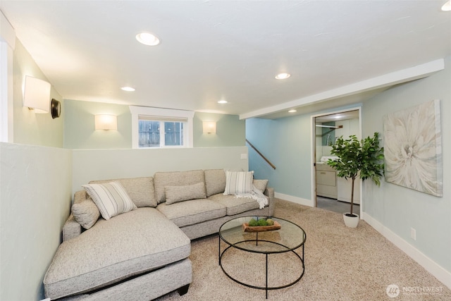 carpeted living area featuring recessed lighting and baseboards