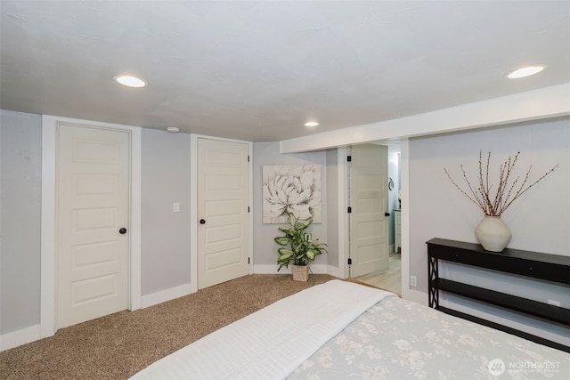 bedroom with recessed lighting, light colored carpet, and baseboards