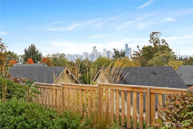 view of yard with a deck and a city view