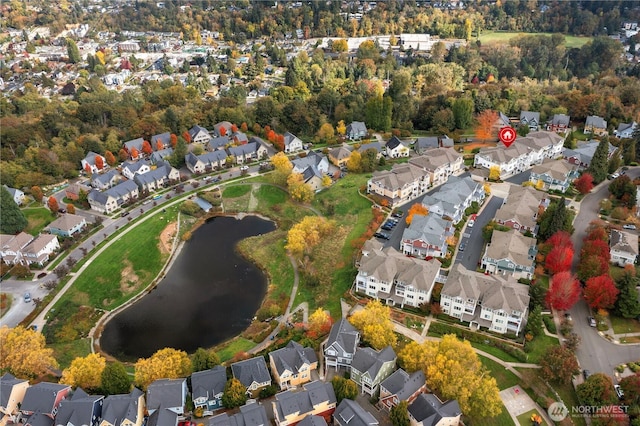 birds eye view of property featuring a residential view and a water view