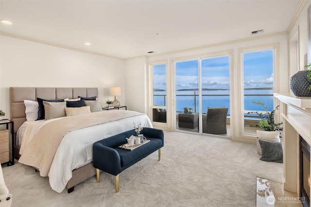 bedroom with a water view, light carpet, ornamental molding, access to exterior, and visible vents