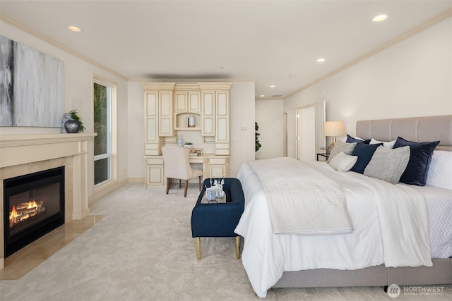 bedroom with light carpet, a tile fireplace, recessed lighting, and crown molding