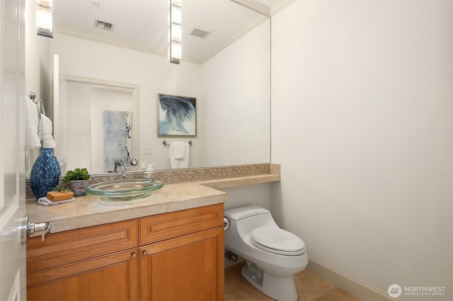 half bath with toilet, visible vents, and crown molding