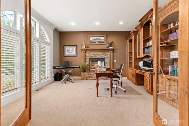 office with baseboards, recessed lighting, a fireplace, and light colored carpet