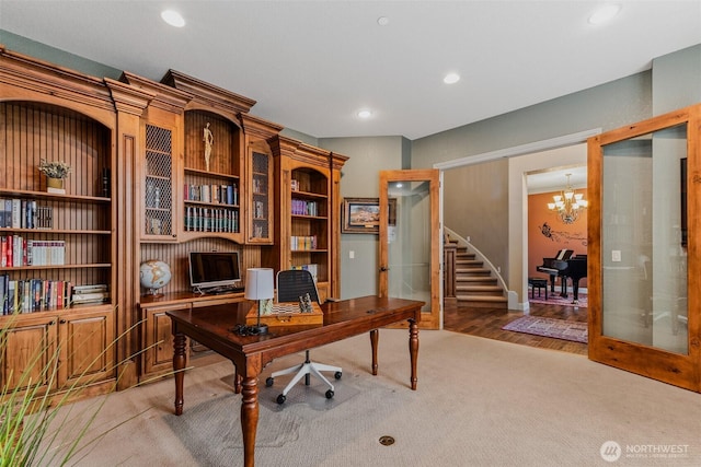 office area featuring a chandelier, recessed lighting, french doors, and light carpet