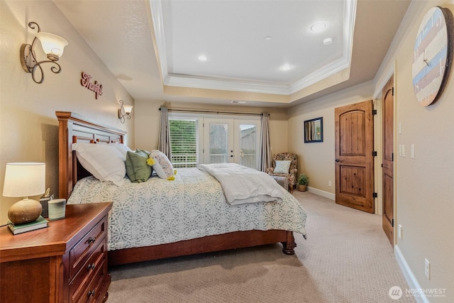 bedroom with light carpet, baseboards, access to exterior, a tray ceiling, and french doors