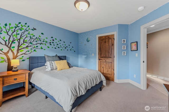 carpeted bedroom with baseboards