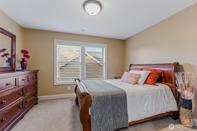 bedroom with light carpet, baseboards, and visible vents