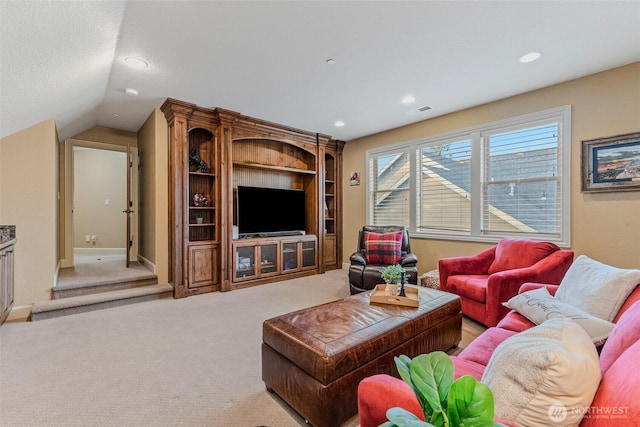 living room featuring vaulted ceiling, carpet floors, and recessed lighting