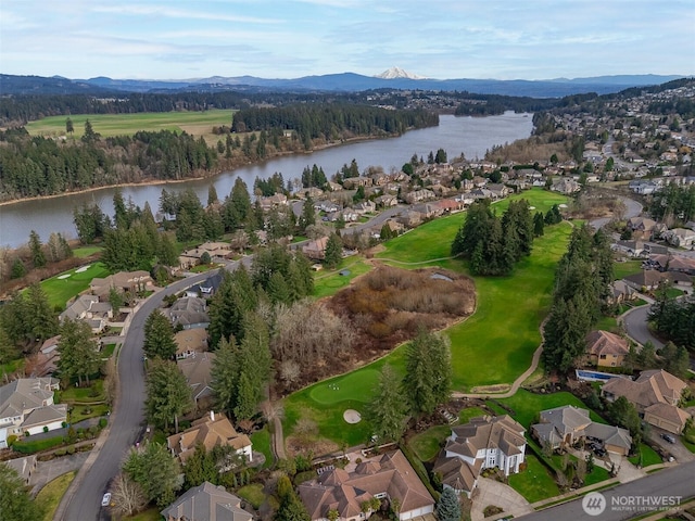 birds eye view of property featuring a residential view and a water and mountain view