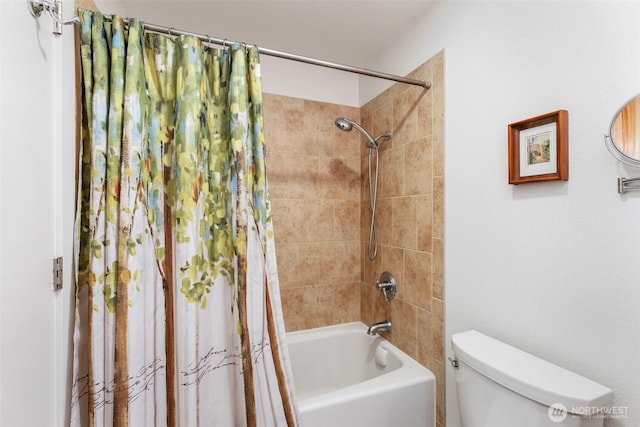 bathroom featuring shower / bath combination with curtain and toilet