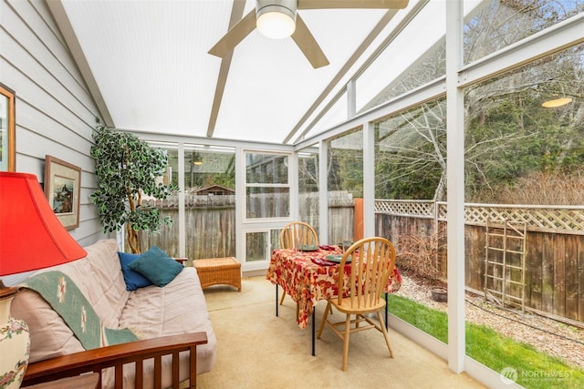 sunroom / solarium featuring lofted ceiling and ceiling fan