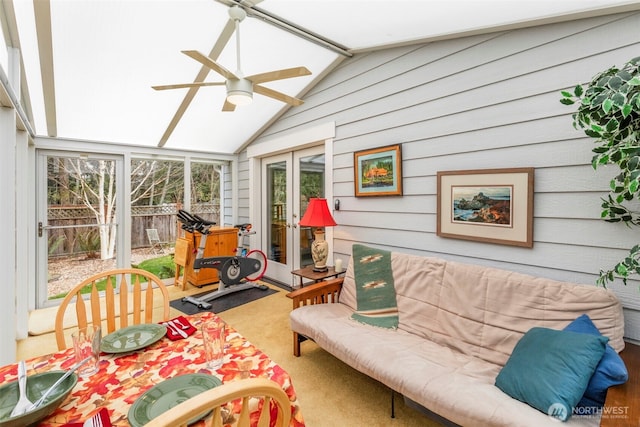 sunroom / solarium featuring lofted ceiling, french doors, and ceiling fan