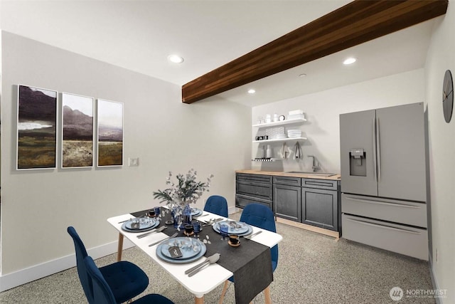 dining room featuring baseboards, light speckled floor, beam ceiling, and recessed lighting