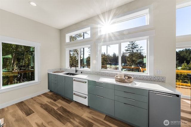 kitchen featuring gray cabinets, light countertops, and wood finished floors