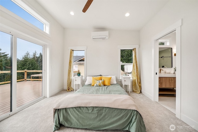 bedroom with recessed lighting, carpet floors, access to exterior, a wall mounted air conditioner, and ensuite bath