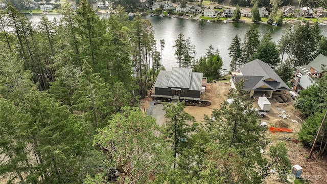 drone / aerial view featuring a water view and a residential view