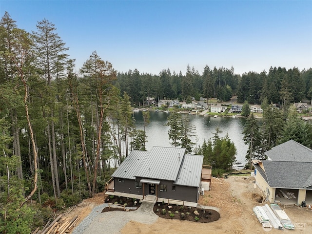 aerial view featuring a water view and a view of trees