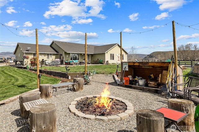 10893 Brick Mill Rd, Ellensburg, WA 98926 - rear view of house with a fire pit and a lawn