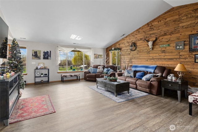 10893 Brick Mill Rd, Ellensburg, WA 98926 - living area with wood walls, wood finished floors, and vaulted ceiling