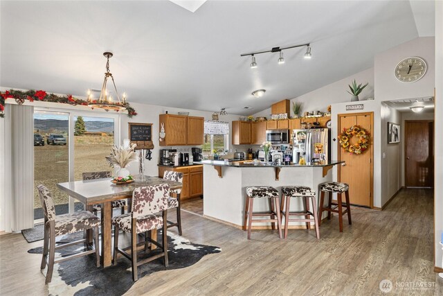 10893 Brick Mill Rd, Ellensburg, WA 98926 - dining space with light wood finished floors and lofted ceiling