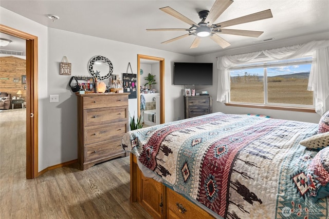 10893 Brick Mill Rd, Ellensburg, WA 98926 - bedroom with wood finished floors, baseboards, a ceiling fan, and visible vents