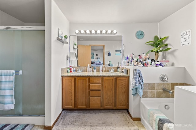 10893 Brick Mill Rd, Ellensburg, WA 98926 - full bathroom with double vanity, a garden tub, a sink, and a stall shower