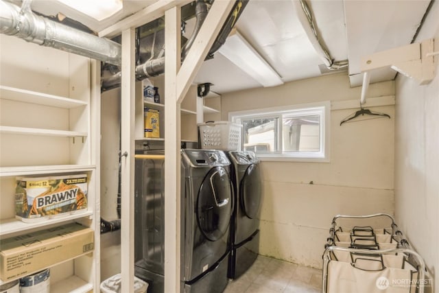 clothes washing area with laundry area and independent washer and dryer