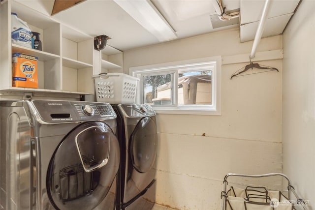 laundry area featuring laundry area and washing machine and clothes dryer