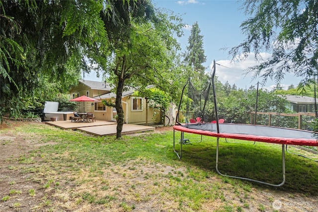 view of yard featuring a trampoline