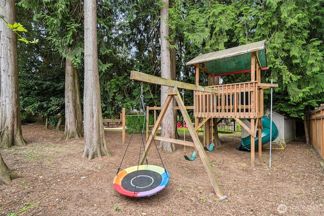 view of playground featuring fence