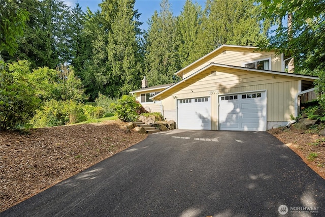 19711 34th Dr SE, Bothell, WA 98012 - view of property exterior with driveway and an attached garage