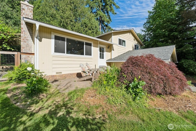 19711 34th Dr SE, Bothell, WA 98012 - back of property with a chimney, crawl space, roof with shingles, and a patio