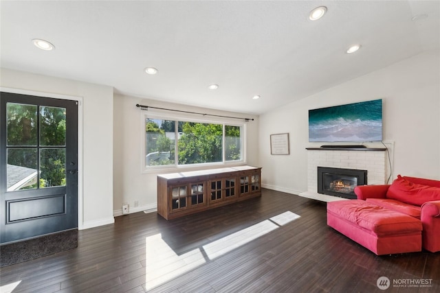 19711 34th Dr SE, Bothell, WA 98012 - living area featuring vaulted ceiling, recessed lighting, wood finished floors, baseboards, and a brick fireplace