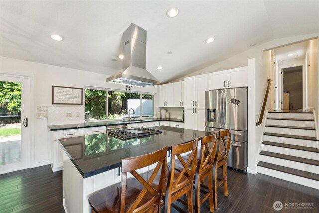 19711 34th Dr SE, Bothell, WA 98012 - kitchen featuring appliances with stainless steel finishes, island range hood, vaulted ceiling, dark wood-style flooring, and a sink