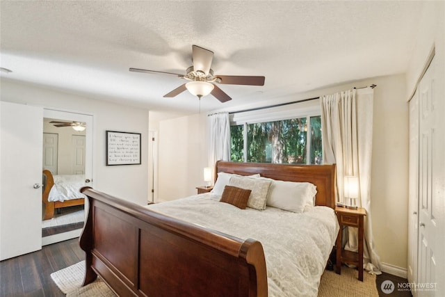19711 34th Dr SE, Bothell, WA 98012 - bedroom featuring dark wood finished floors, ceiling fan, a closet, and ensuite bath