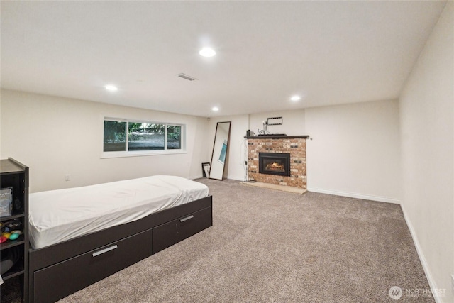 19711 34th Dr SE, Bothell, WA 98012 - carpeted bedroom featuring recessed lighting, a brick fireplace, and baseboards