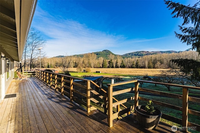 wooden terrace with a mountain view