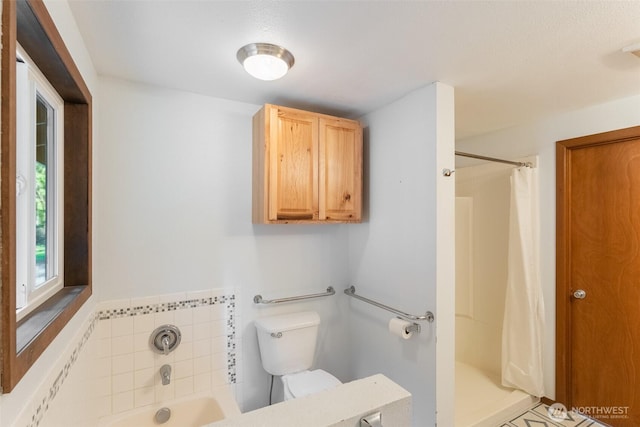 full bathroom with curtained shower, a garden tub, and toilet