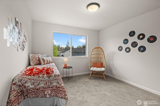 bedroom featuring carpet and baseboards