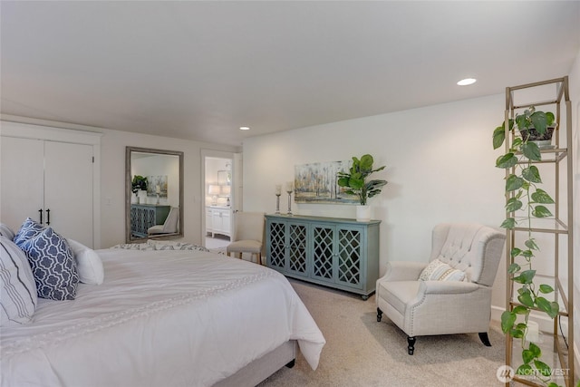 bedroom with light carpet and recessed lighting